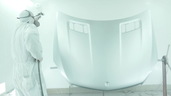 Automotive Paint. Mechanic Painting The Car In Auto Repair Shop