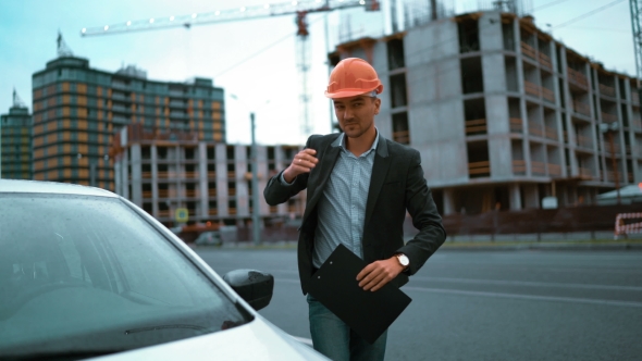Architect Exit His Car And Go To Building Construction