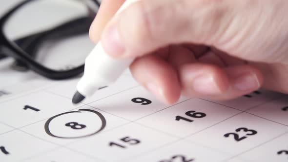 Anonymous Person Encircling Dates Near Glasses