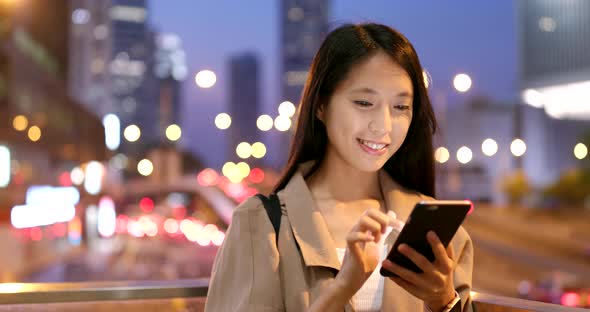 Woman use of smart phone at night