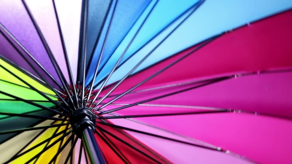Multicolored Umbrella Rotates Background