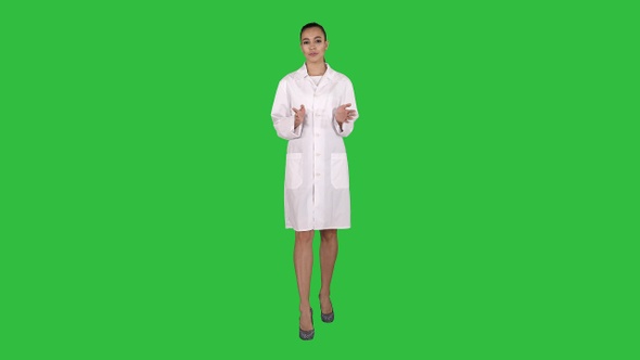 Woman doctor explaining and talking to camera while walking