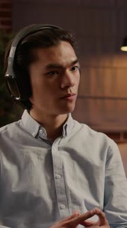 Vertical Video Company Employee Listening to Podcast Episode or Webinar alt