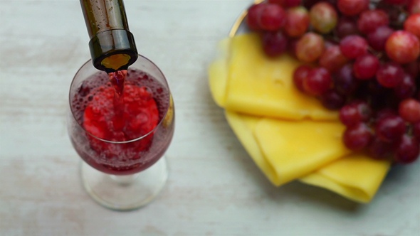 Pouring Red Wine Into Glass.