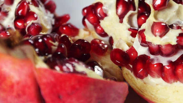 Opened Pomegranate Detail With Beautiful Red Fleshy Seeds
