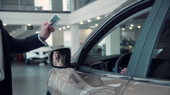 Sales Manager Gives The Client The Keys From The Car