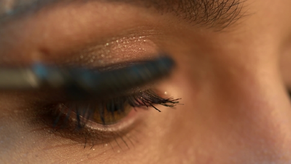 Make-up Artist Applying Eyelash Makeup to Model's Eye