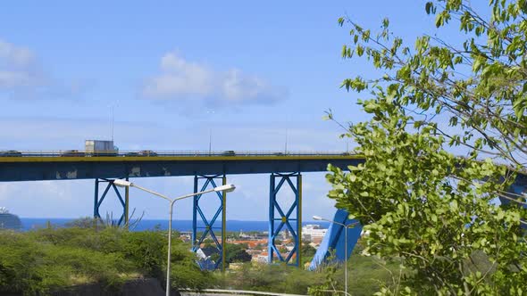 Vehicles driving over the Queen Juliana Bridge in Willemstad on the Caribbean island of Curacao. Med