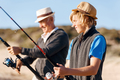 Senior man fishing with his grandson - PhotoDune Item for Sale