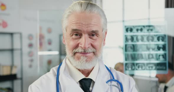 Doctor Which Looking Into Camera with Sincerely Smile in Hospital Workroom