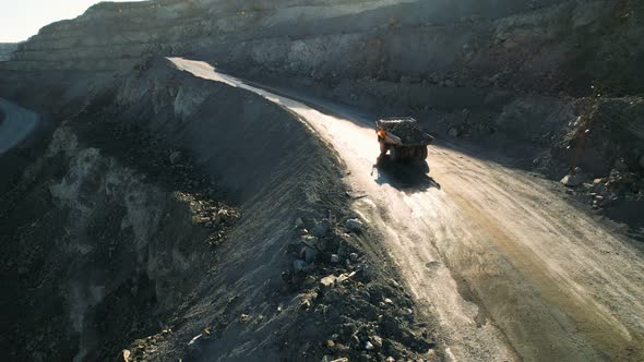 Mining truck is driving an opencast quarry. Quarry Dump Truck.