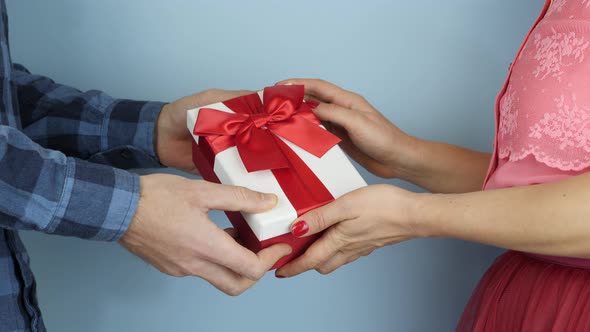 Woman is receiving gift box for St. Valentine's Day or Birthday