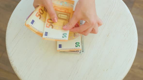 Hands Counting Euro Pound and Dollars Banknotes