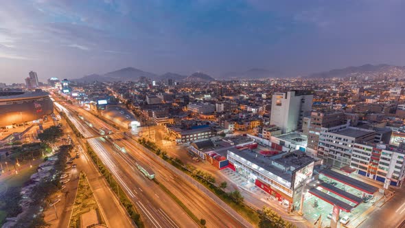 Aerial View of Via Expresa Highway and Metropolitan Bus with Traffic Day to Night Timelapse