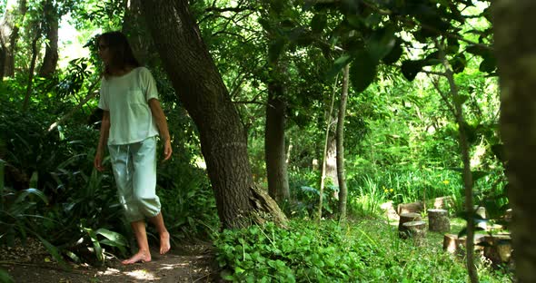 Mature woman walking in the park 4k