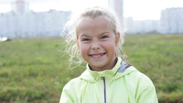 Cute Little Girl Aping and Looking to the Camera