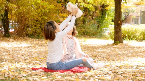 Girls Enjoy a Little Puppy