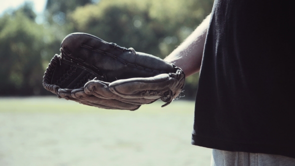 Baseball Player Tossing Ball Into Glove