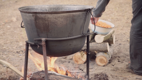 Cooking Soup With Lamb In a Cauldron.
