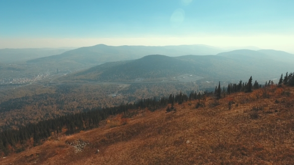 Aerial View From The Top Of The Mountain Hill. The Village Below