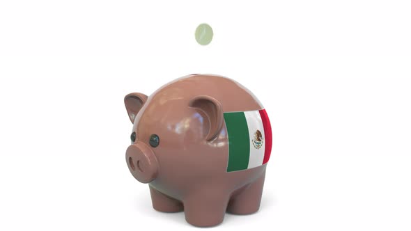 Putting Money Into Piggy Bank with Flag of Mexico