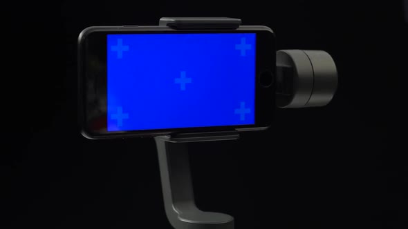 A Steadycam in Motion with the Blue Screen on Smartphone