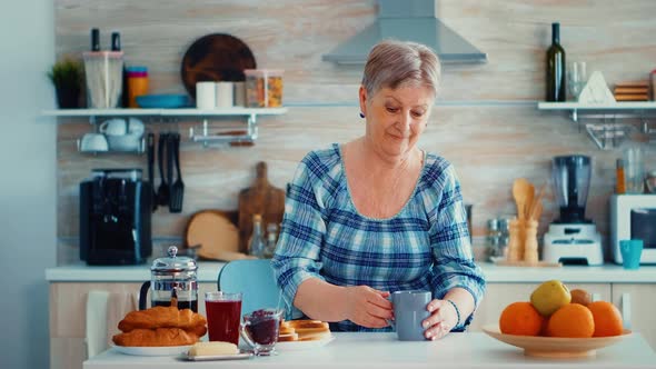 Holding Cup of Coffee