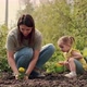 Mom and Daughter are Planting a Flower - VideoHive Item for Sale