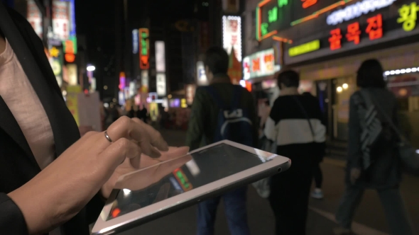 Woman With Digital Tablet In Night Seoul, Republic Of Korea