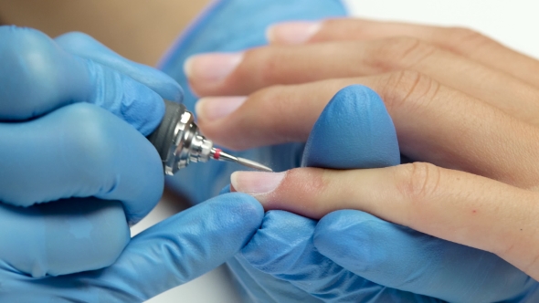 Master Makes To Client a Hardware Manicure.