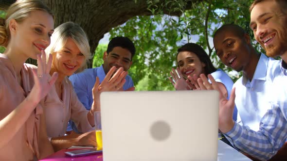 Group of friends video chatting on laptop