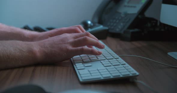 Typing keyboard man remote working, close-up slow motion, studio shot in 4K prores HQ