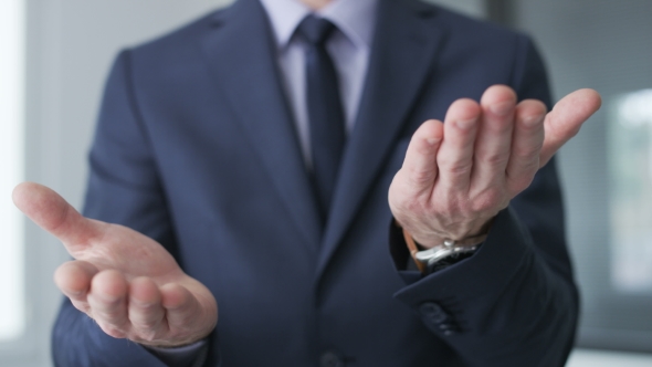 Businessman making the okay gesture with his hands