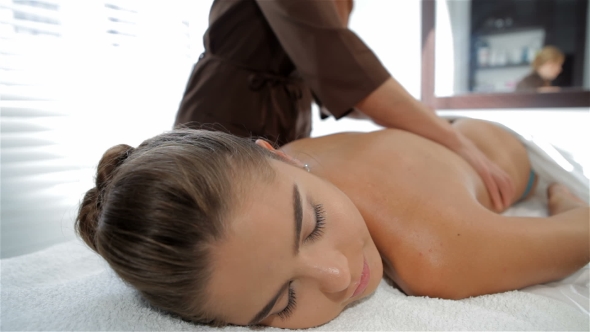 Massage Specialist Begins To Massage Female Client