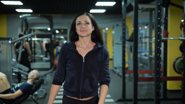 Beautiful Girl Walks At The Gym