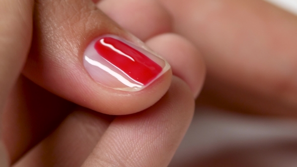 Cover The Nail By Red Varnish