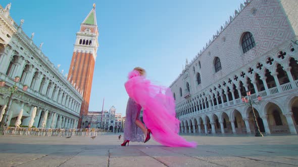 Model Walks Moving Happily in Heels and Pink Dress in Venice