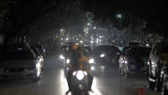 Motorbikes And Cars In Night Hanoi Vietnam alt