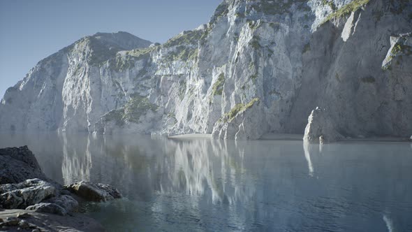 Sand Beach Among Rocks at Atlantic Ocean Coast in Portugal alt