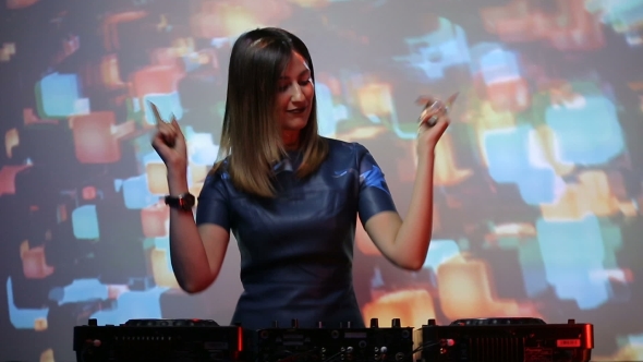 DJ Girl On Decks At The Club