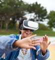 Cool millennial black woman with virtual reality glasses, on a s - PhotoDune Item for Sale