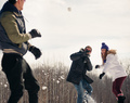 Group of friends enjoying a snowball fight in the snow in winter - PhotoDune Item for Sale