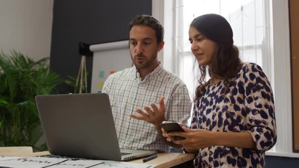 Millennial creative professionals working in a creative office