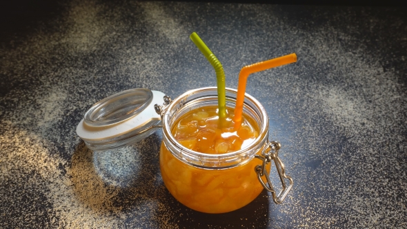 Jam From Orange In A Glass Jar.