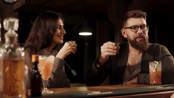 A Couple of Friends Drinking at Bar