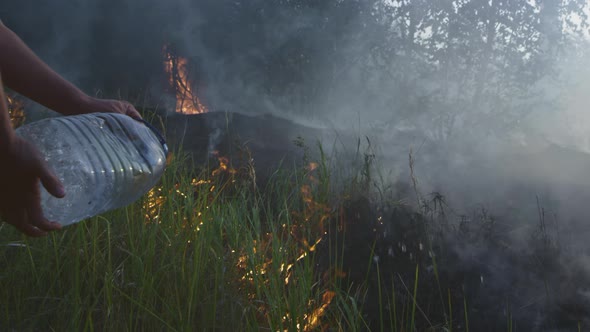 A Volunteer Man or Boy Extinguishes a Wild Fire