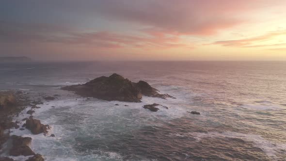 Amazing drone aerial sea landscape view of Cape Tourinan Lighthouse, in Spain at sunset
