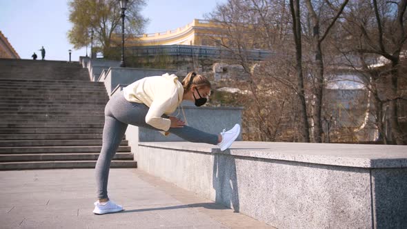 Beautiful Young and Fit Woman Doing Sport Excercises Alone on the Stairs of City Center Area Wearing