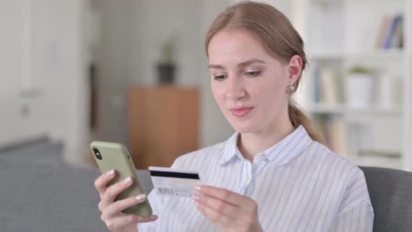 Portrait of Successful Online Payment on Smartphone By Young Woman