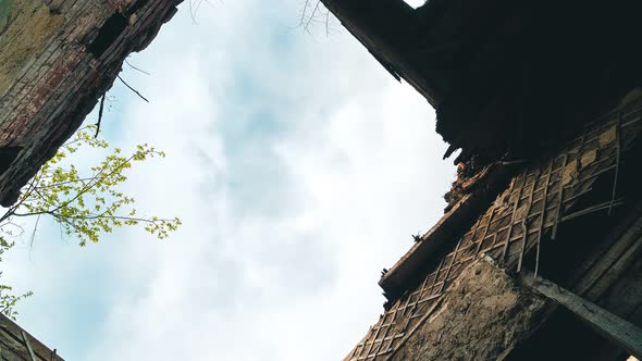 Beautiful time lapse video in motion clouds of an abandoned building. Dramatic atmosphere